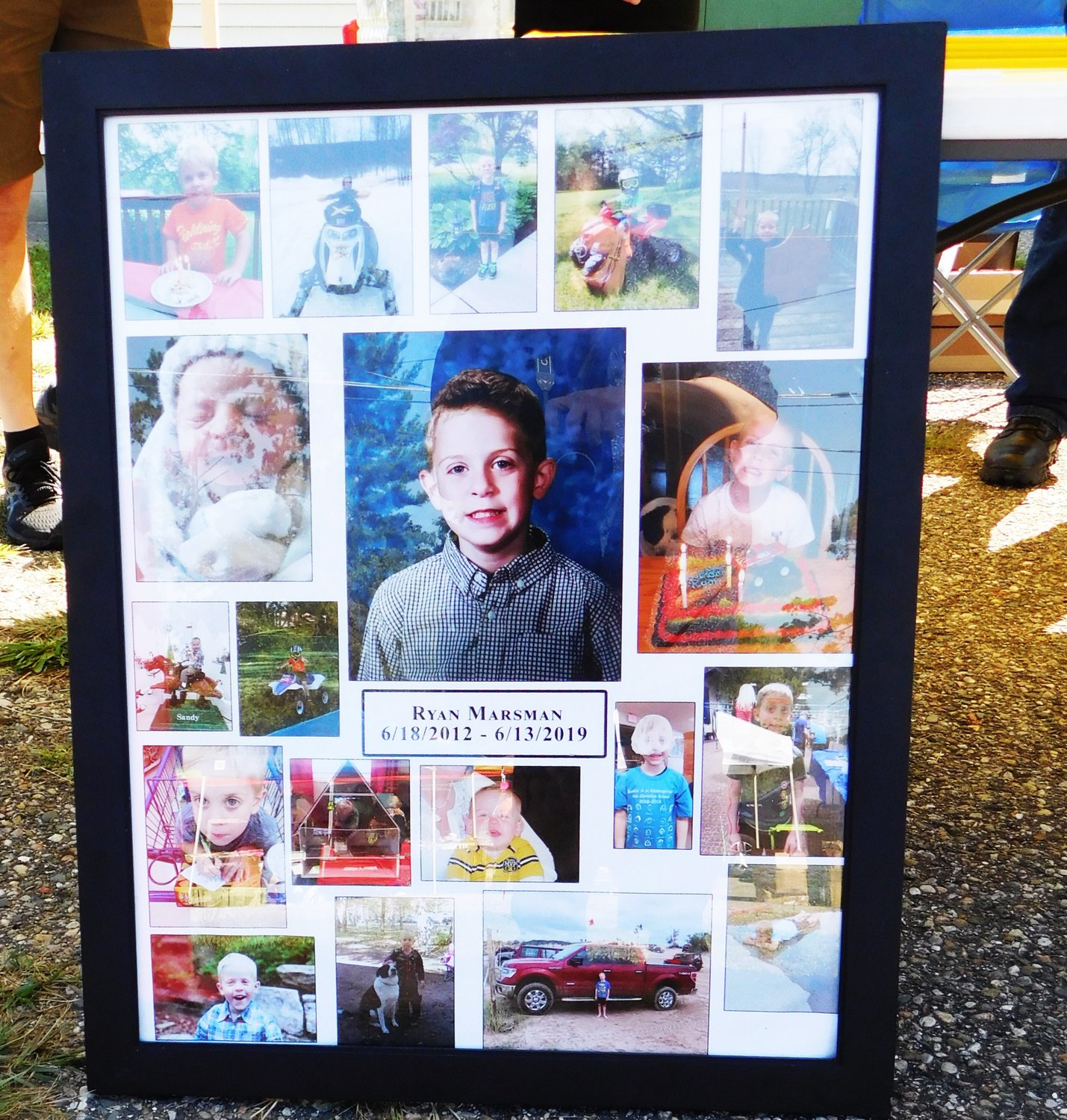 This photo collage of Ryan Marsman’s brief young life was displayed at the Riding For Ryan booth at Street Fair.